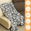Black and white patterned blanket on a beige couch with orange feature panel.