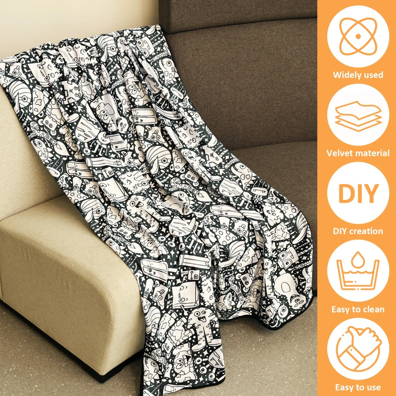 Black and white patterned blanket on a beige couch with orange feature panel.